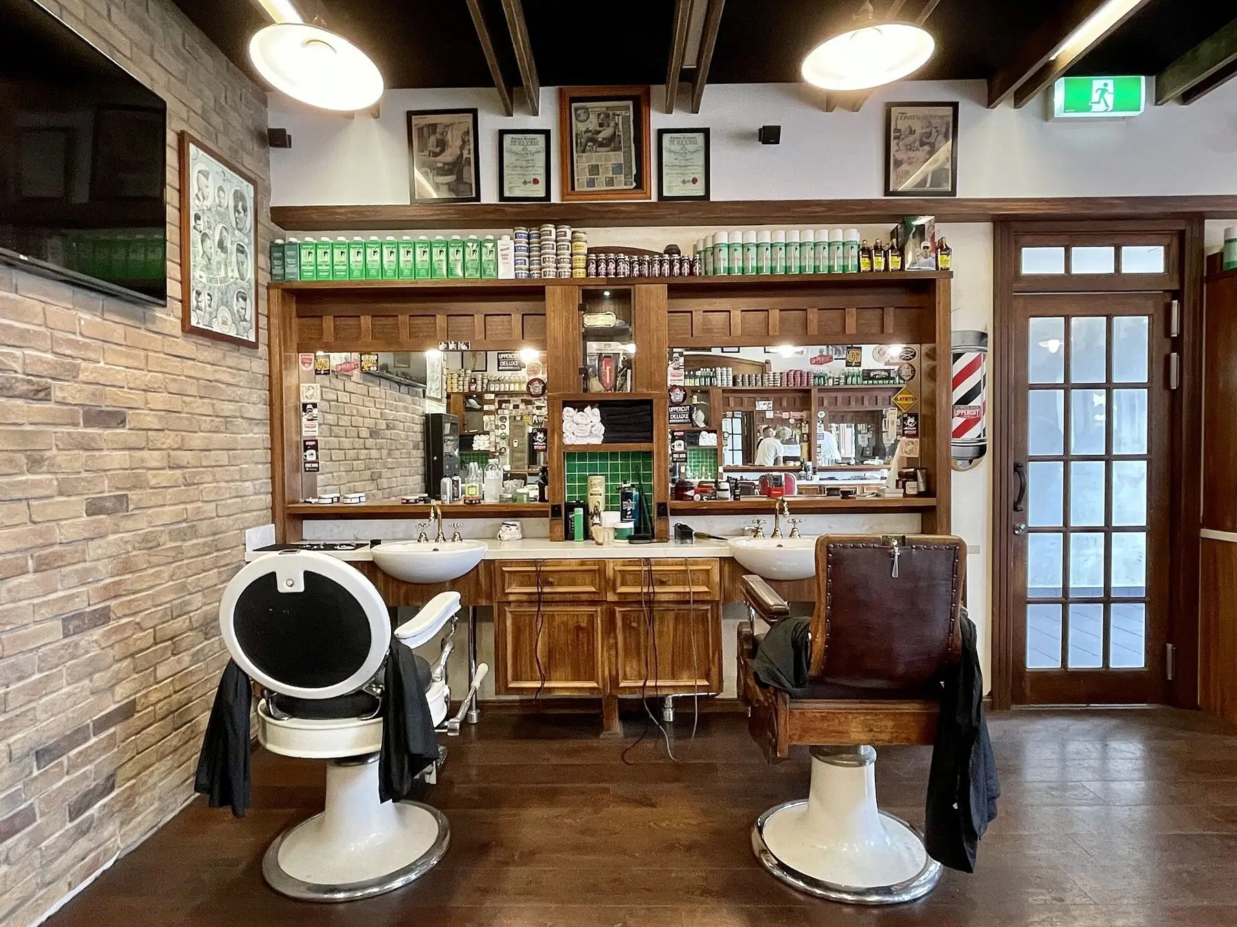 The shop floor: two chairs, brick and brass
