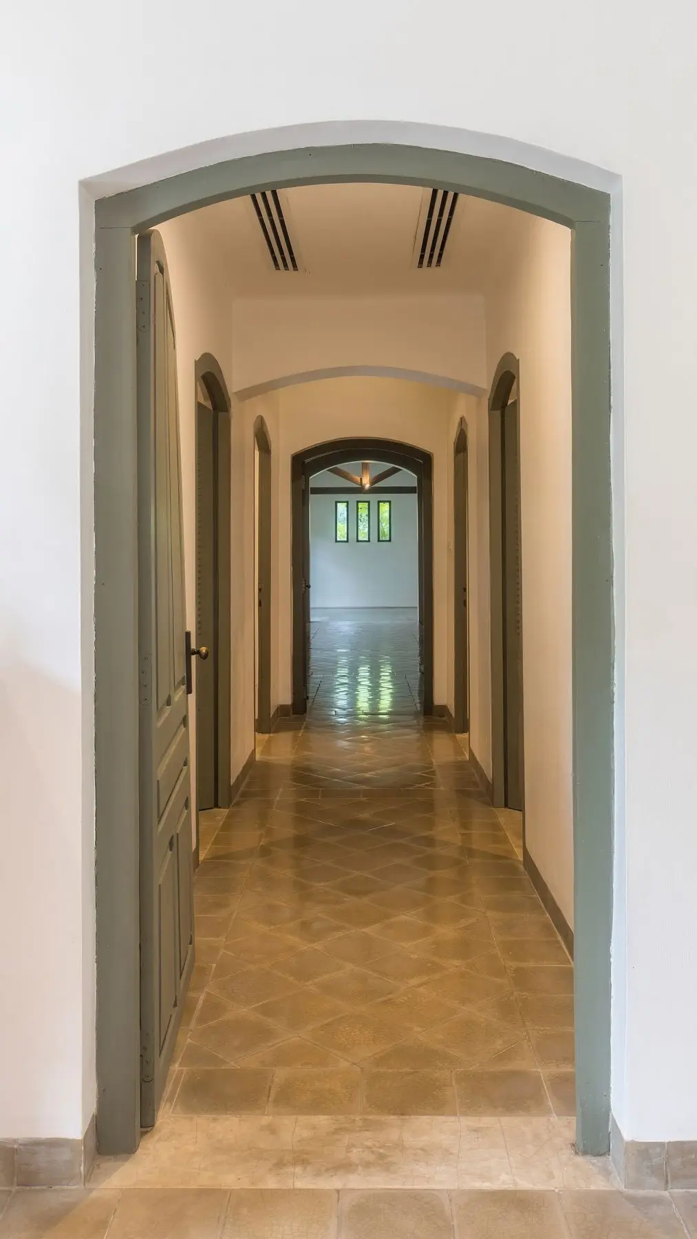 The arched corridor down to the spa