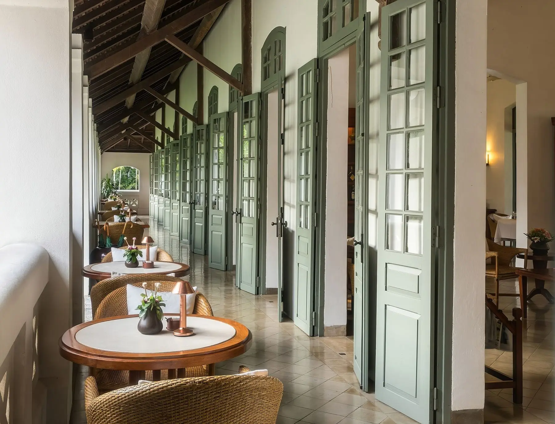 Breakfast tables along the shuttered terrace